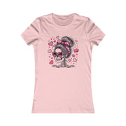 Pink t-shirt with a skeleton wearing sunglasses and a bow, surrounded by hearts on a white background.