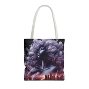 Tote bag with a stylized design of a woman with an afro and cityscape in the background on a white background