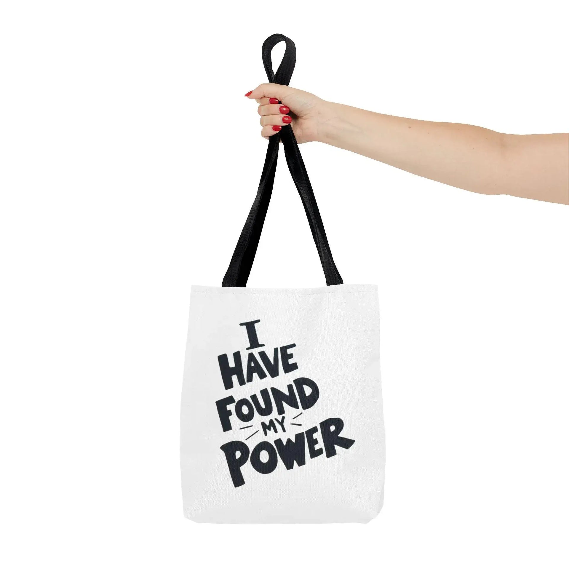 Tote bag with 'I Have Found My Power' text held by a hand on a white background
