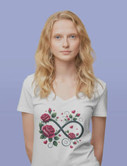 Woman wearing a white t-shirt with a floral infinity symbol design on a purple background