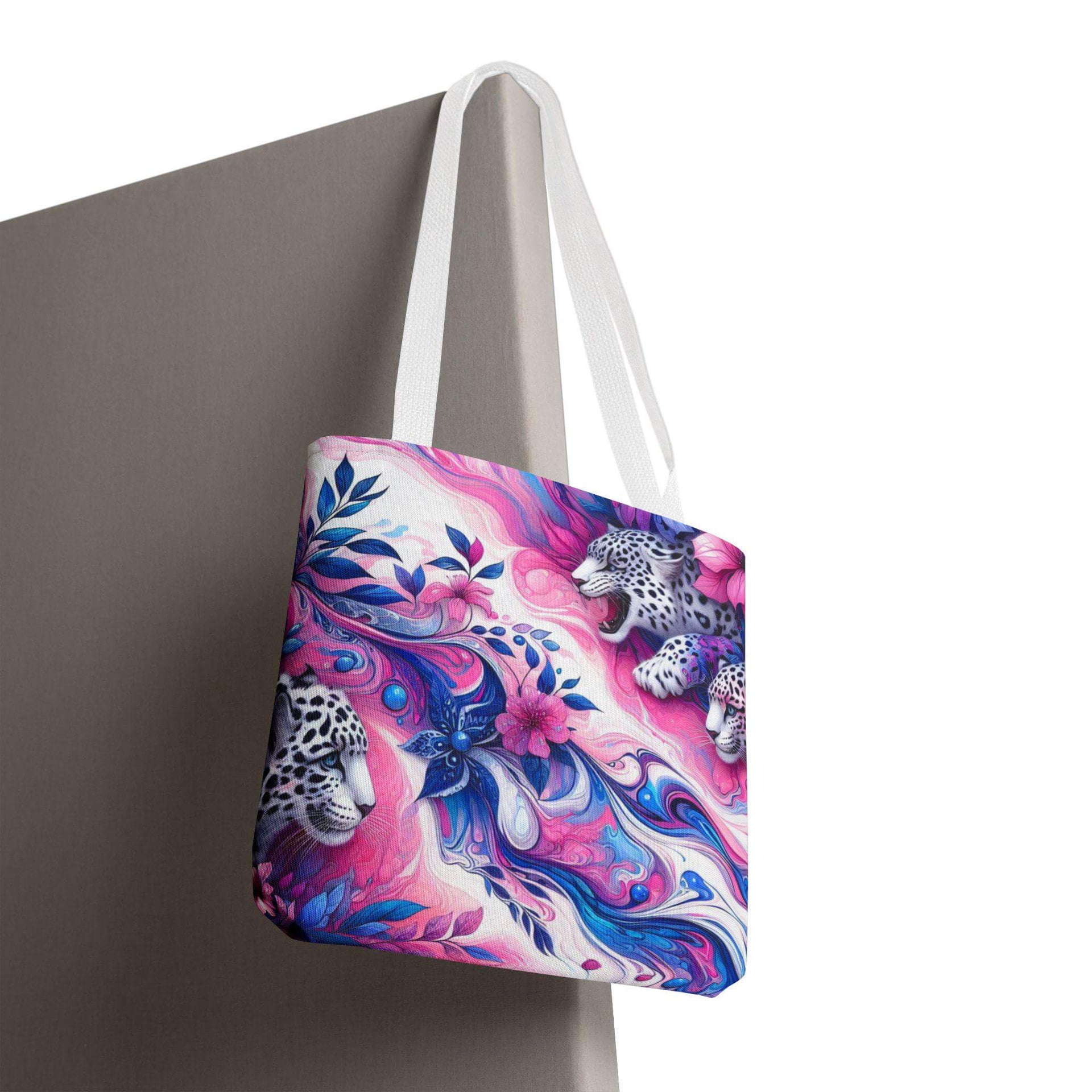 Tote bag with colorful design featuring leopards and flowers on a white background