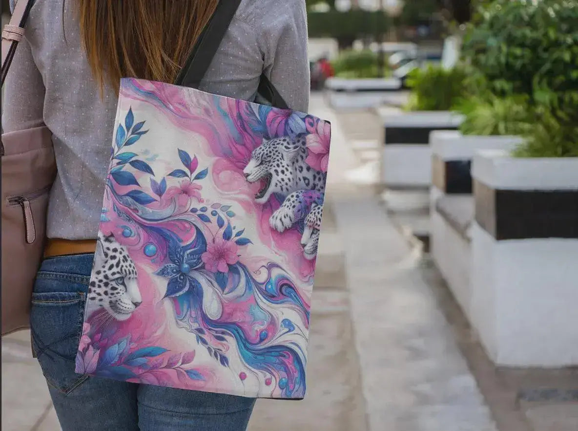 Person holding a colorful tote bag with animal design outdoors