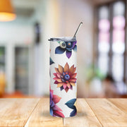 Tumbler with floral design on a wooden table