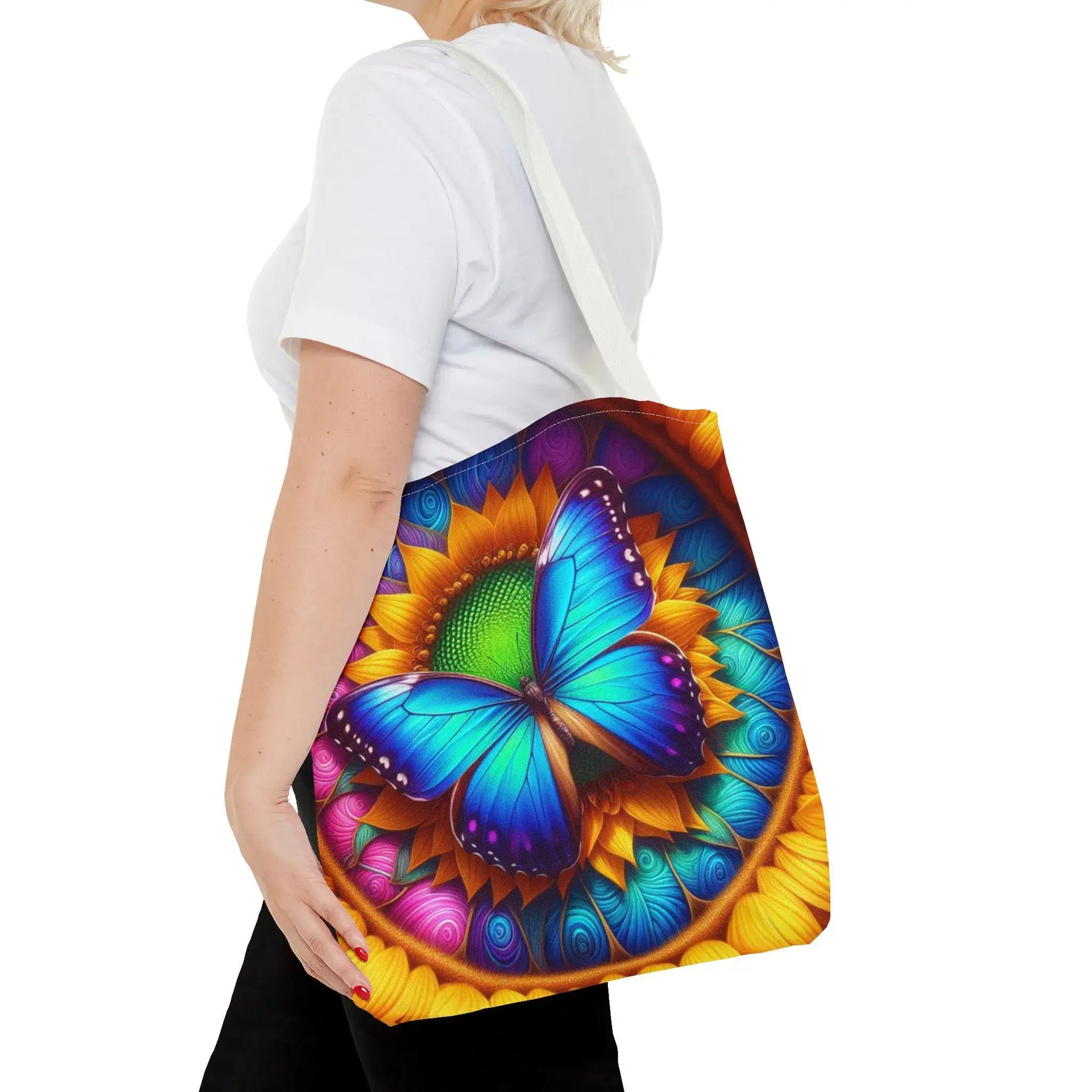 Person holding a colorful bag with butterfly design on a white background