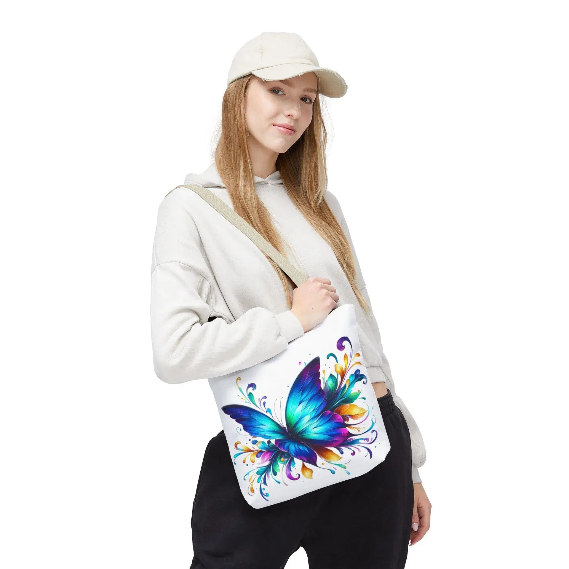 Rainbow Flutter Tote Bag worn on shoulder with black handles
