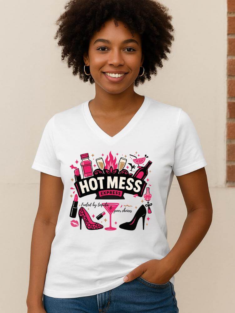 Woman wearing a white t-shirt with 'Hot Mess' design, standing against a beige wall.