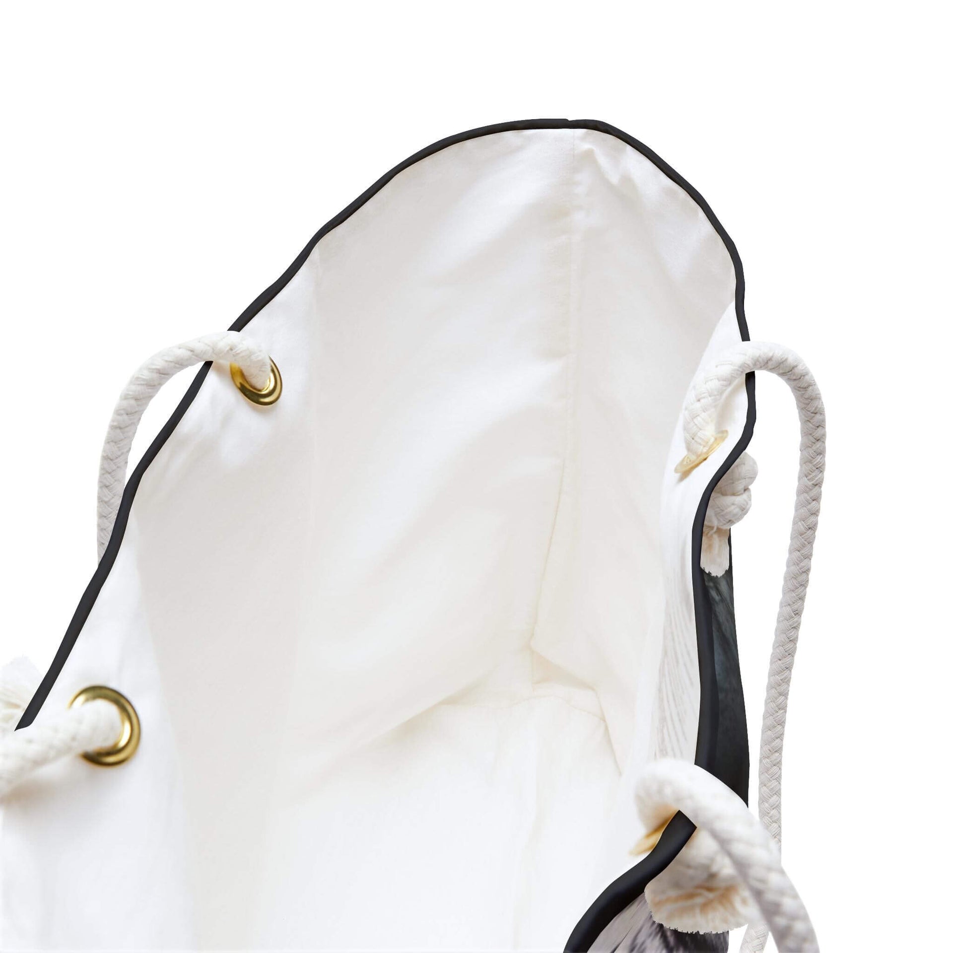 White drawstring bag with black accents and gold metal loops on a white background