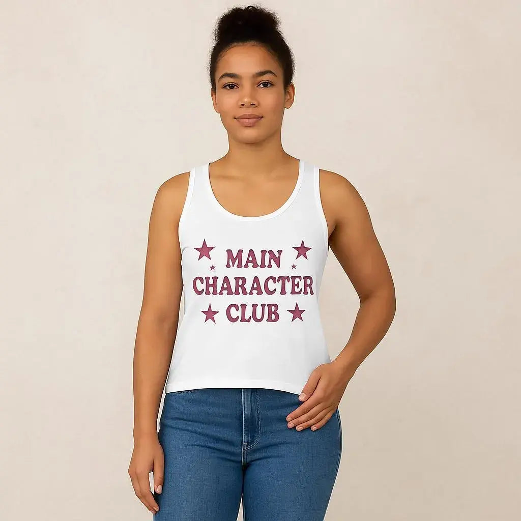 Person wearing a white tank top with 'MAIN CHARACTER CLUB' text and stars on a beige background
