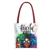 Tote bag with a colorful design of a woman with afro hair and 'Peaceful Vibes' text on a white background.