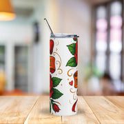 Tumbler with a colorful design on a wooden table in a blurred indoor setting