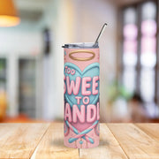 Tumbler with 'Too Sweet to Handle' design on a wooden table with a blurred background