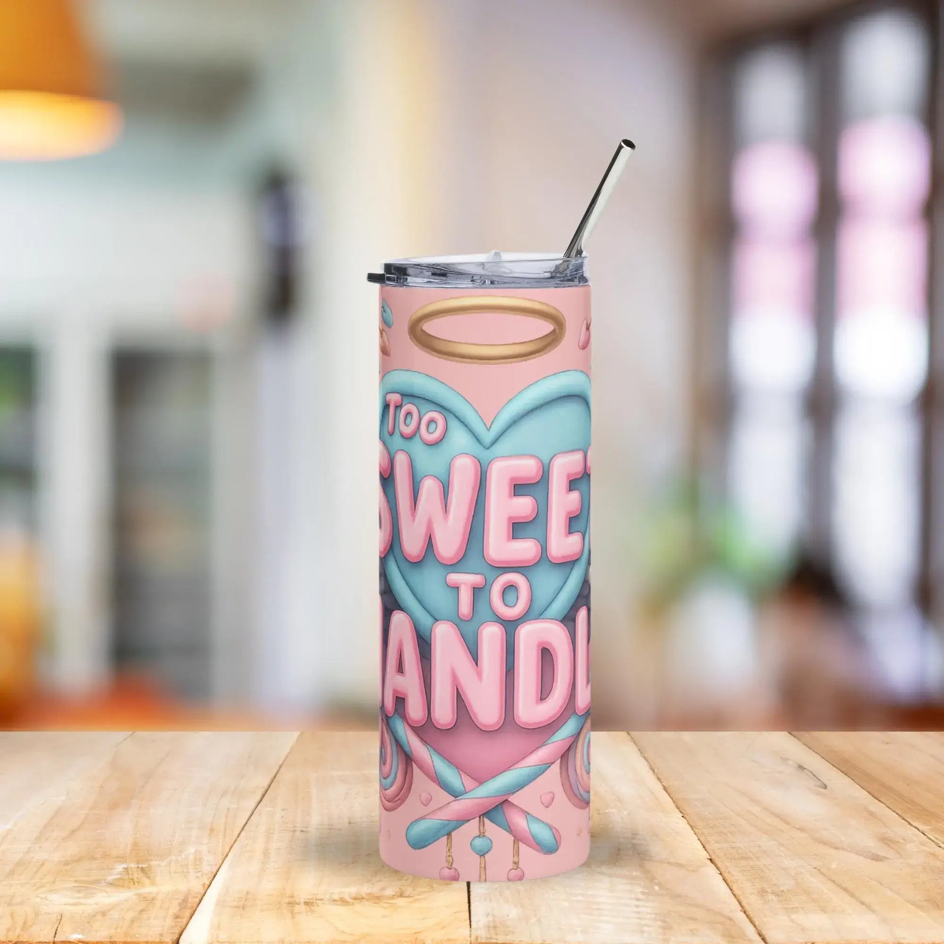 Tumbler with 'Too Sweet to Handle' design on a wooden table with a blurred background