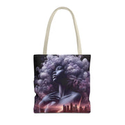 Tote bag with a stylized design of a woman with a large afro and cityscape in the background on a white background.