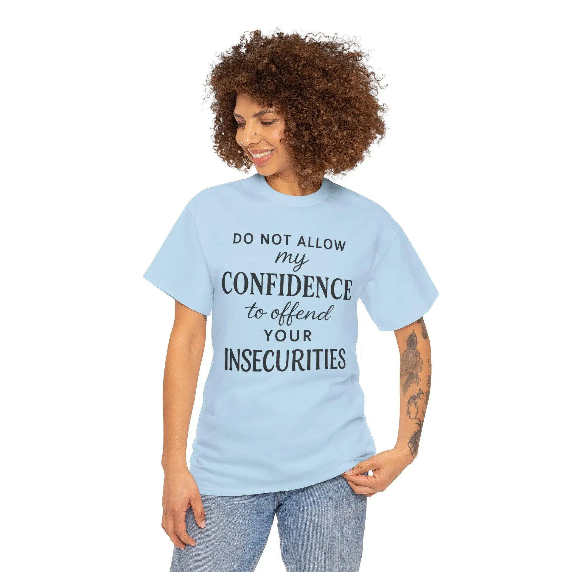 Woman wearing a light blue t-shirt with a motivational quote on a white background