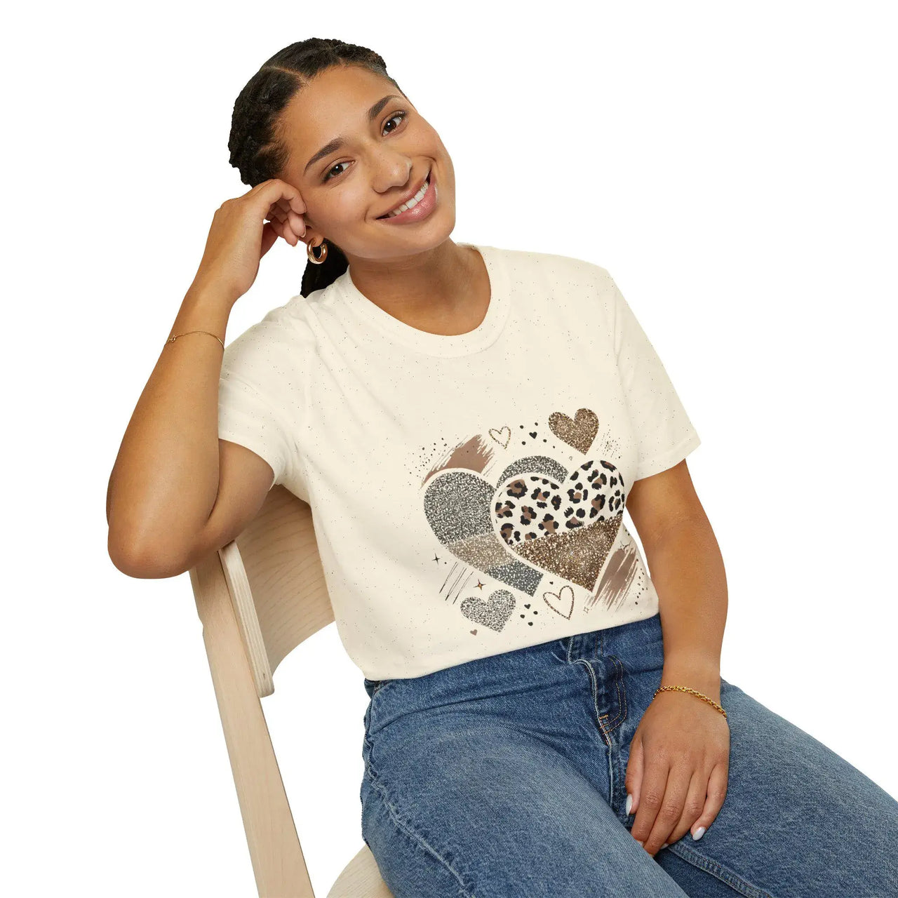 Model seated wearing leopard & glitter heart graphic tee