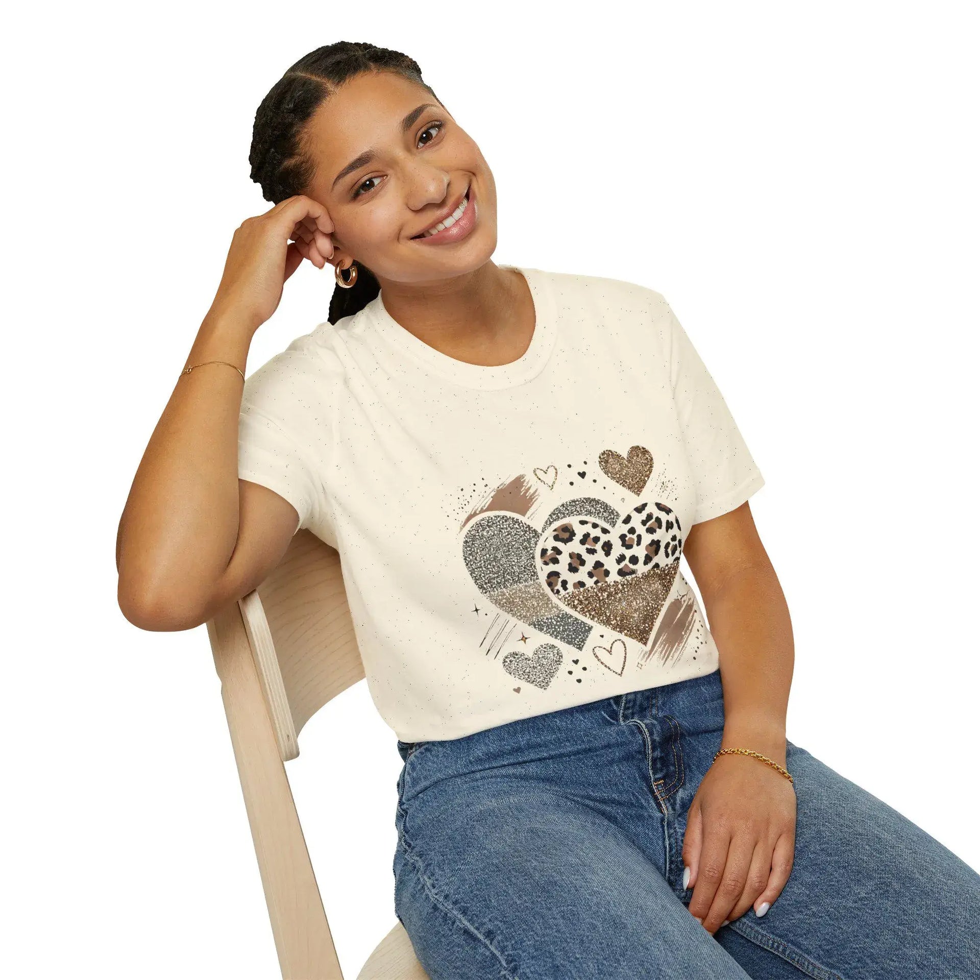 Model seated wearing leopard & glitter heart graphic tee