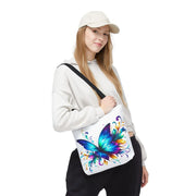 Person holding a white bag with a colorful butterfly design on a white background