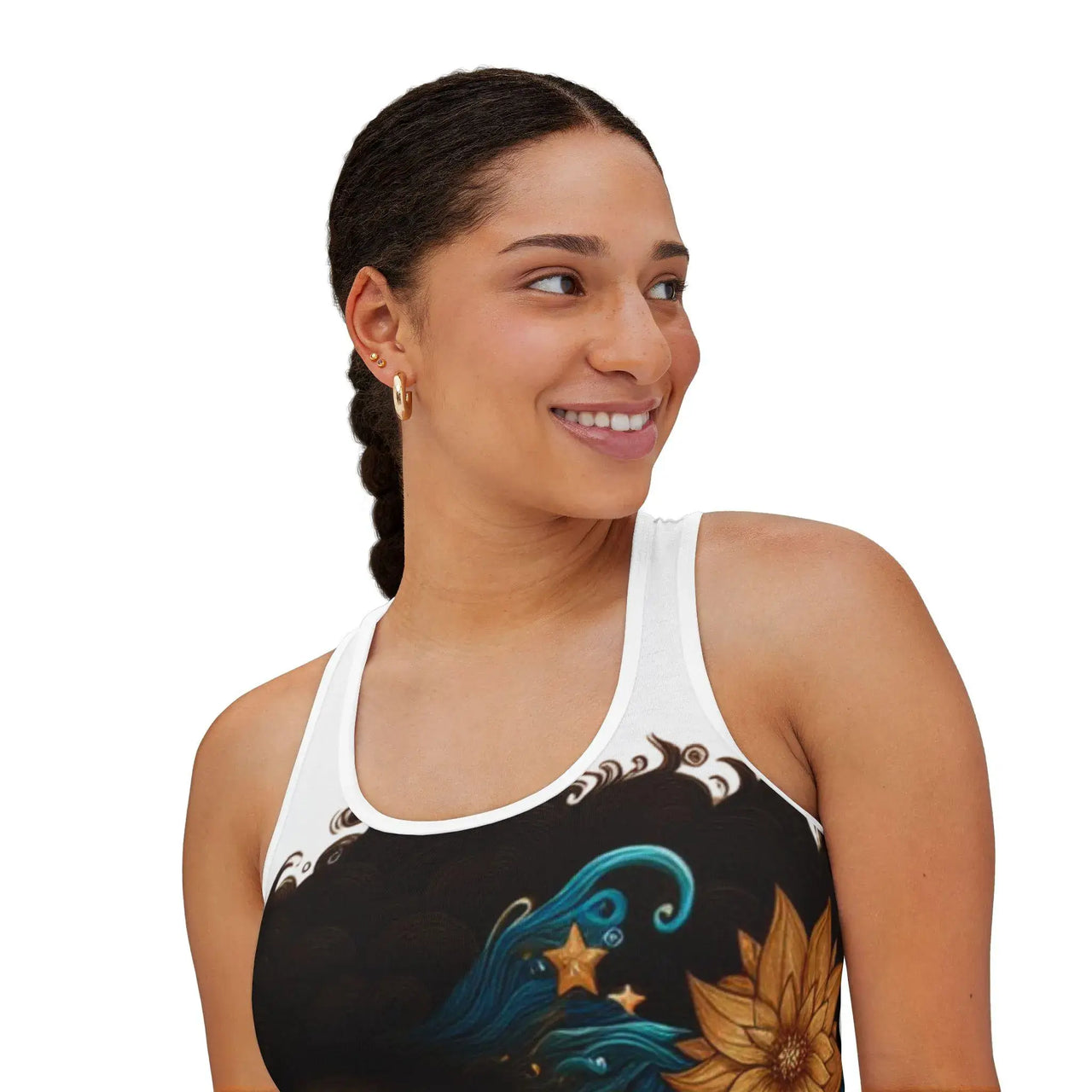 Woman wearing a black tank top with artistic designs on a white background