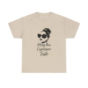 Beige t-shirt with a graphic of a woman with sunglasses and text on a white background