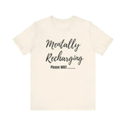 Beige t-shirt with 'Mentally Recharging Please WAIT' text on a white background