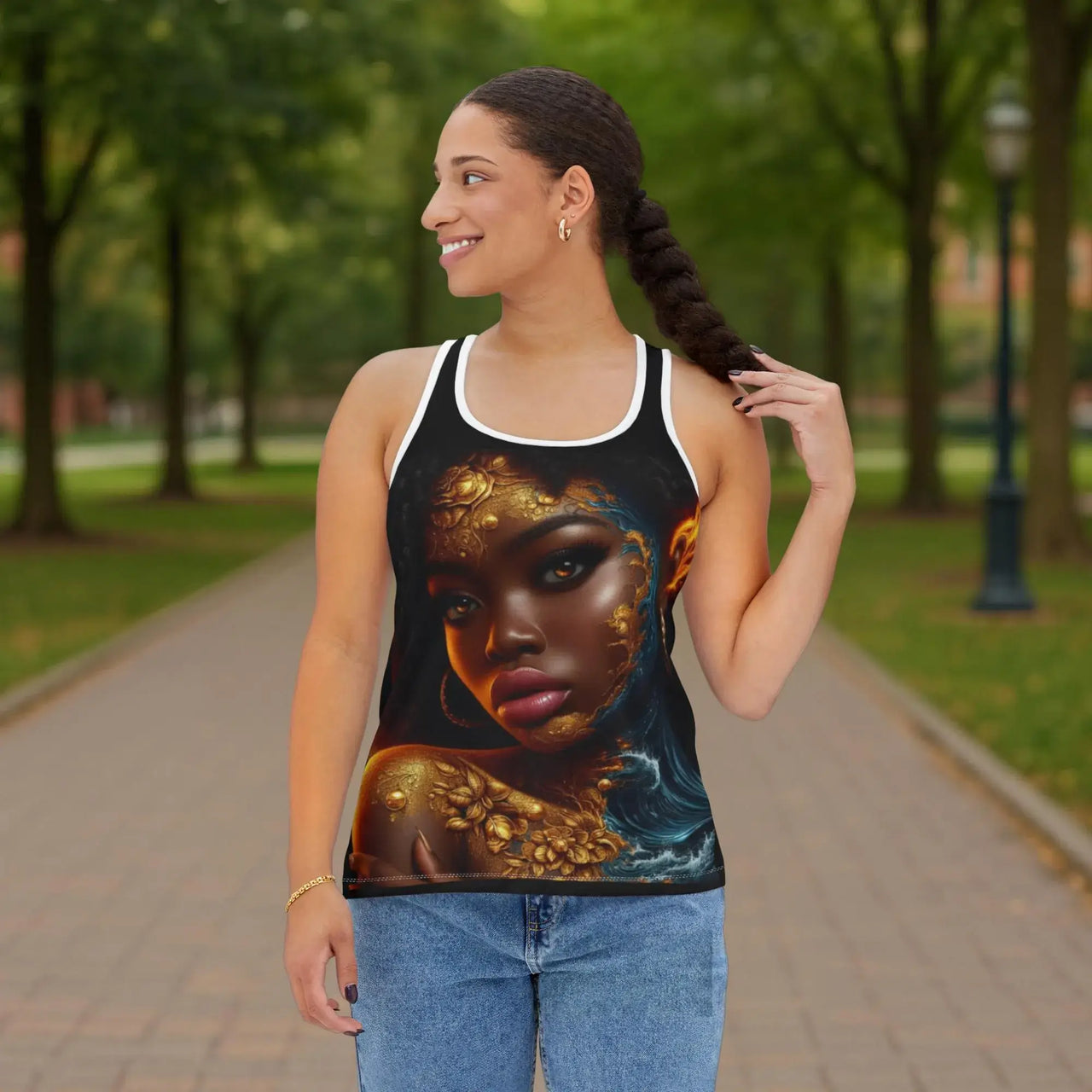 Woman wearing a tank top with a artistic depiction of a woman's face in a park.