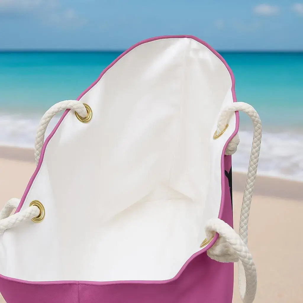 White drawstring bag with pink bottom on a beach