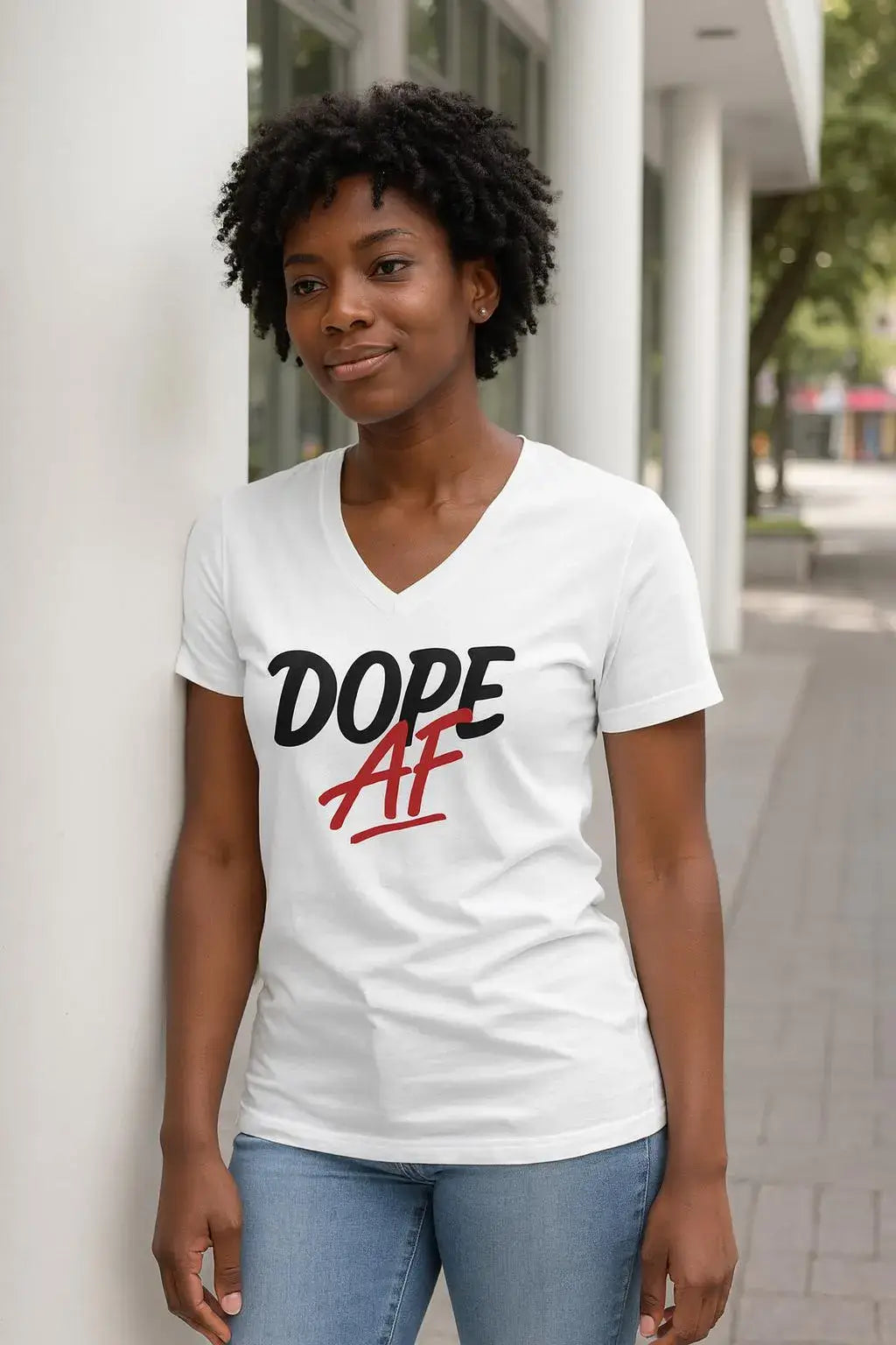 Person wearing a white t-shirt with 'Dope AF' text, standing outdoors.