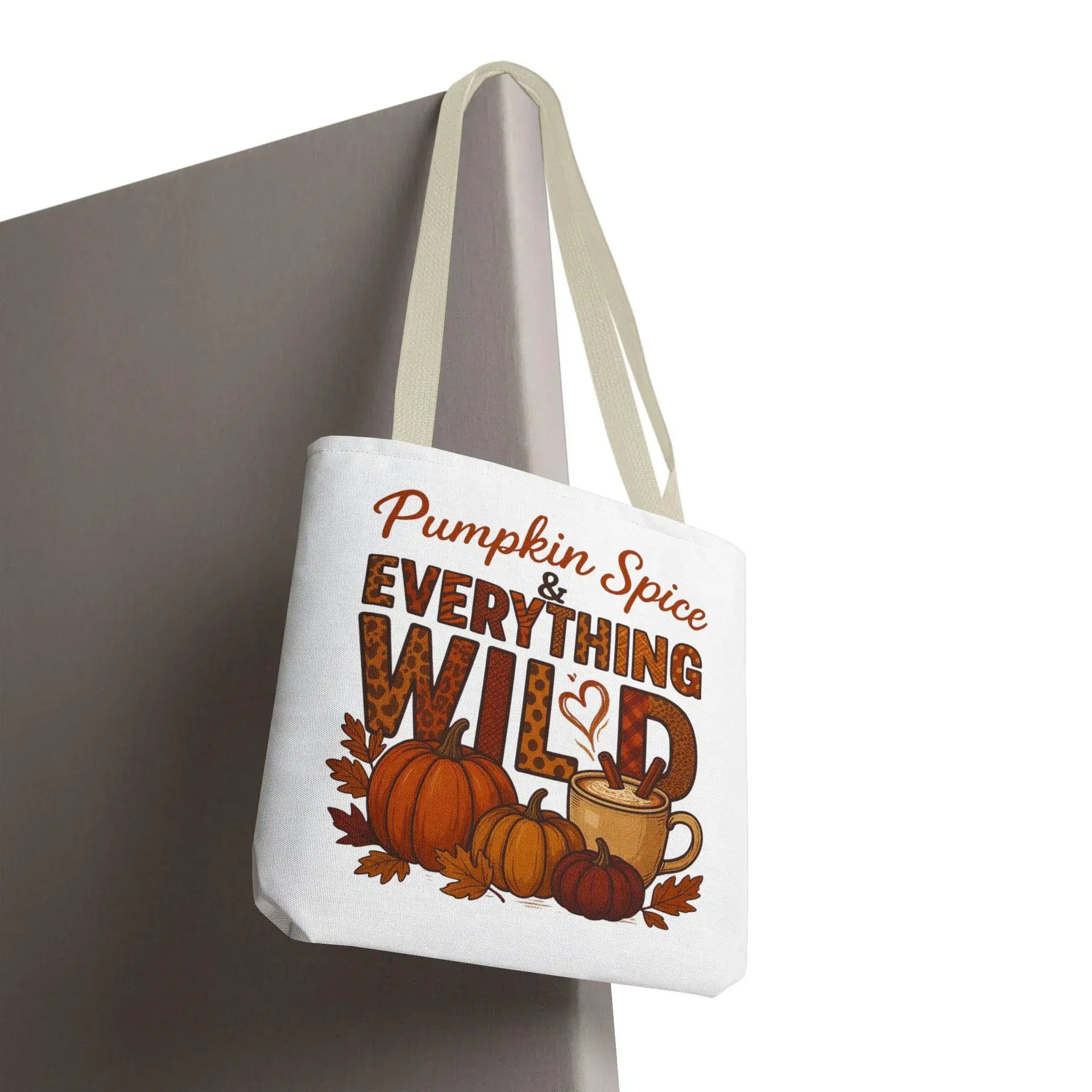 Tote bag with 'Pumpkin Spice & Everything Wild' text and pumpkins design on a white background