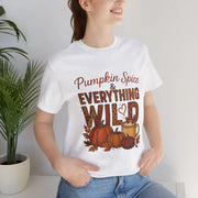 Person wearing a white t-shirt with 'Pumpkin Spice & Everything Wild' text and graphics.