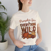 Person wearing a white t-shirt with 'Pumpkin Spice & Everything Wild' design.