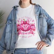 Person wearing a white t-shirt with a pink pumpkin design and text, paired with a denim jacket.